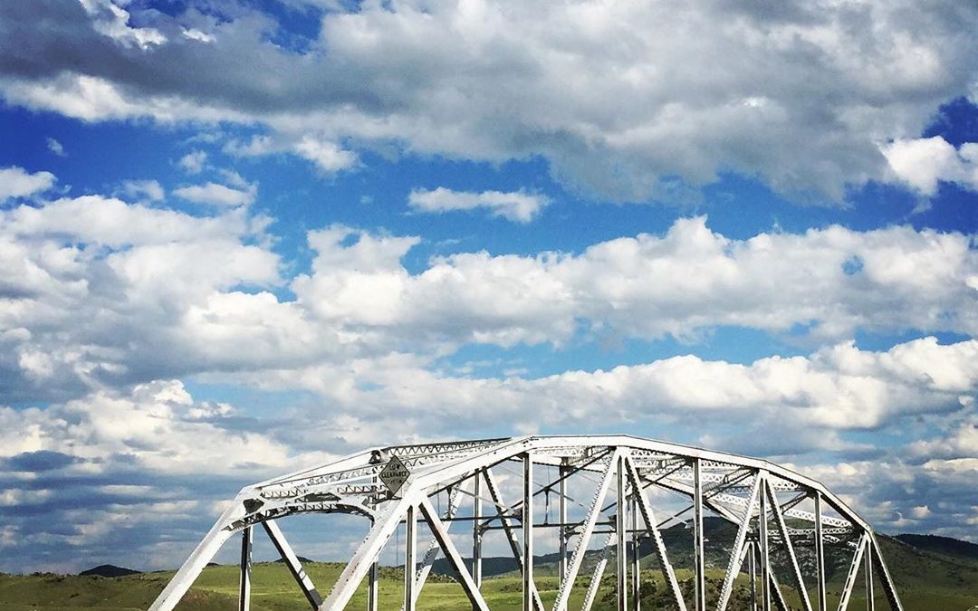Puffy white clouds over The Bridge. #montana #threeforks #headwaterscountryjam #…