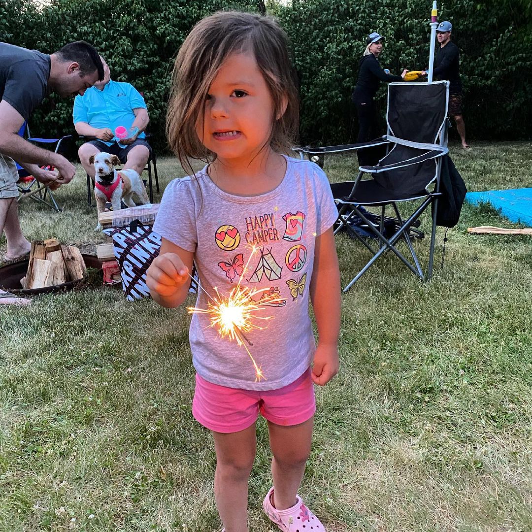 This happy camper is enjoying her first sparkler. #happycamper #familytime #aunt…