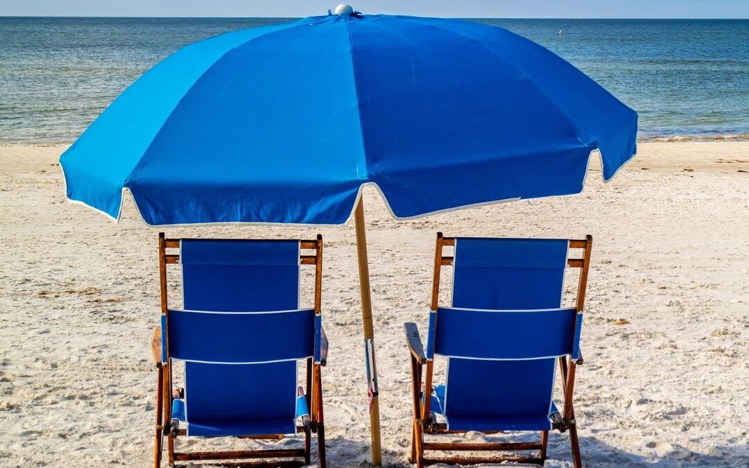 Oh, those blue chairs all lined up perfectly on the beach, giving you an amazing…