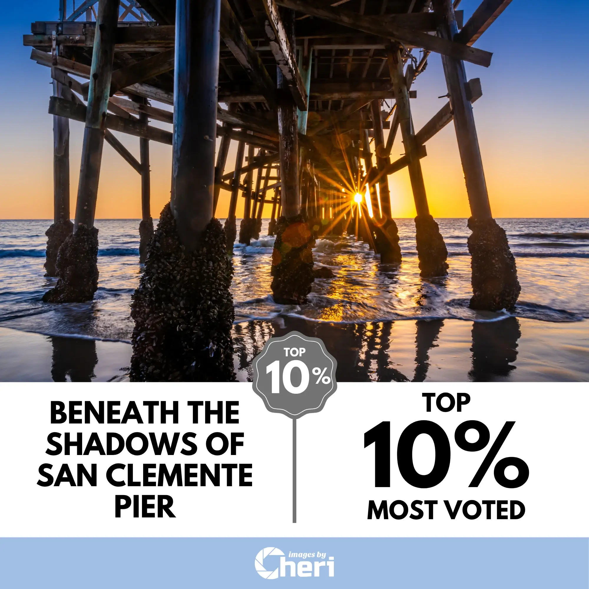 San Clemente Pier Sunset Photo showing the sun bursting through the wooden pilings from beneath the pier. This perspective earned a Top 10% Most Voted graphic